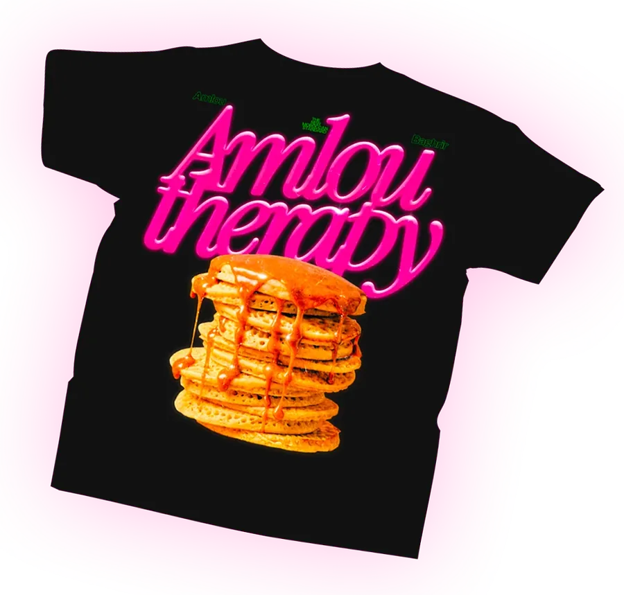 Black Amlou Therapy t-shirt with a pink glossy script and a stack of baghrir